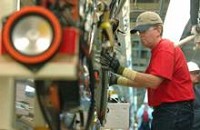 David Wright gets certified on the assembly line at the Toyota Motor Manufacturing Indiana plant in Princeton, Ind., on Wednesday. October 29, 2008. Production has been suspended since August 8 due to the declining market of full size trucks and SUVs but will resume November 10. The Princeton plant will no longer produce the Tundra truck but will switch over production to the Sequoia and Highlander. Employees remained coming to work during the production suspension to receive training to help make the plant run more efficiently. ERIN McCRACKEN / Courier &amp; Press