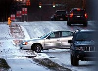 Several drivers found last Friday’s icy streets tough to navigate. Above, the incline along Riverside Avenue just east of New York Avenue caught drivers off guard during the morning traffic. City salt trucks salted the hill about 9 a.m. (Kyle Evens / The Star Press)