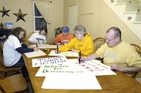 Concord Township Trustee Deb Stoffer (far left) makes posters in favor of township government with the help of (from left) Charity Wasson, Tony Smith, Sandy Kraus and Chris Kraus. Stoffer, who’s sponsoring a “Save Township Government” rally on Sunday, touts the role of township government in serving some of the most vulnerable people. Truth photo by Larry Tebo