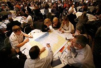 Participants at the Forum on the Future of Northwest Indiana look over a map of the region Saturday to locate where they live and work and the areas they enjoy. About 500 community members gathered at the Radisson Hotel in Merrillville for the forum to give feedback to the Northwestern Indiana Regional Planning Commission, which is working on a comprehensive development plan for the region. JOHN LUKE | THE TIMES