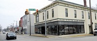 Greenwood's plans for sparking new life into Old Town include tearing down the buildings on the southeast corner of the Main Street-Madison Avenue intersection to widen Main Street, where Van Valer Law Office is located. Preservation groups said the two-story brick buildings are a part of Greenwood’s history that cannot be replaced. STAFF PHOTO BY SCOTT ROBERSON