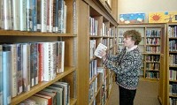 Cate Birdseye is director at the Garrett Public Library, one of four library systems in DeKalb County. In spite of the number, residents in 11 of the county’s 15 townships live outside of a library district, almost one-third of the county’s residents. Samuel Hoffman | The Journal Gazette