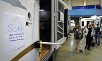 A “Sold” sign marks a Fleetwood trailer Sunday at the Fort Wayne RV and Camping Show at Memorial Coliseum. Samuel Hoffman | The Journal Gazette
