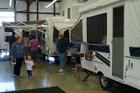 Shoppers view units in the CAMPLAND RV showroom in Burns Harbor. Owner Al Paschen said that sales are slow and he's not replacing the inventory that's sold. TONY V. MARTIN | TIMES FILE PHOTO