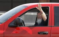 A BorgWarner employee waves as he leave the factory earlier this month. (The Star Press File Photo)