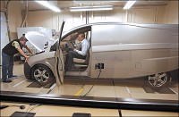Bright Automotive headquarters. Engineers Patrick Kaufman and Justin Goeglein prepare the Idea for another test run on the conpany's dual axle dynamometer in their workshop on the first floor of the Flagship Enterprise Center. John P. Cleary / The Herald Bulletin