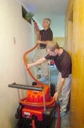 Jeff McCall, left, founded Duct Doctors after he lost his job. He works with his son Jason. Samuel Hoffman | The Journal Gazette