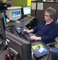 City dispatcher Jodi Terman handles 911 calls. A tentative agreement to combine city and county 911 centers was announced Monday. Samuel Hoffman | The Journal Gazette