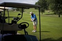 Randy Christie, of Indianapolis, prepared to hit his golf ball down the fairway at Jasper Municipal Golf Course on Thursday morning. Christie makes it a point to make the trek down state annually to play this course and others nearby. NEIL BLAKE/THE HERALD