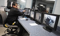 Watchful eye: Correction officer Jason Neice monitors the comings and goings of inmates in work release. Inmates are heavily monitored both while in the building and out in the community. Tribune-Star/Rachel Keyes 