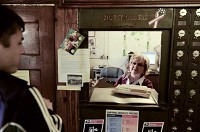 
Noah Fritts, 14, drops off mail to Mackey Postmaster Lynn Cromer one afternoon last month. DENNY SIMMONS / Courier &amp; Press
