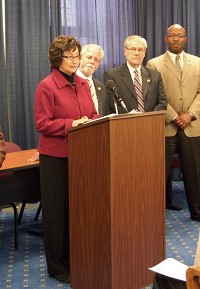 Indiana Senate Minority Leader Vi Simpson is joined by three of her caucus members, Tim Lanane of Anderson, Jim Arnold of LaPorte, and Greg Taylor of Indianapolis, at a press conference during the 2011 legislative session.
