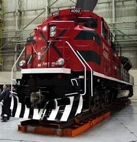 A new locomotive is unveiled to a crowd at Progress Rail&rsquo;s open house in October 2011. A labor dispute in Canada might mean more work will becoming to the Progress Rail plant in Muncie / The Star Press file photo



