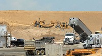Workers keep going on I-69 near the U.S. 50 Bypass (above) on Tuesday. The construction, led by Walsh Construction, is on schedule to be complete by the end of 2012. Staff photo by Kelly Overton