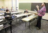 Mathew Stevens teaches a seminar class at Ivy Tech's 38th street location on Wednesday. Ivy Tech graduation rates have been on the rise. Staff photo by Don Knight