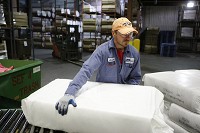 Jason Krol moves product at Unifrax Corp. in New Carlisle on Tuesday. South Bend Tribune/SANTIAGO FLORES (October 17, 2012)