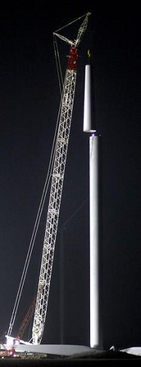 Night shift: Crews have been working day and night to meet the Jan. 1 deadline to finish the 125 turbines. Staff photo by Tim Bath