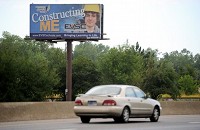 A billboard on northbound U.S. 41, seen in August, highlights the Southern Indiana Career and Technical Center as part of a new EVSC marketing campaign targeting billboards, bus stops and benches aimed at highlighting their schools in an attempt to persuade parents to keep students in public school rather than using the voucher program for private schools. Staff archive photo by Erin McCracken