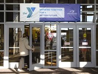 A banner heralding the new relationship with Methodist Hospitals hangs over the entrance of the Valparaiso Family YMCA Friday Dec. 14, 2012. | Andy Lavalley~Sun-Times Media