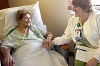 Quality care navigator Gina Harris (right) checks in with patient Margaret Rondinelli of Chesterton at St. Mary Medical Center in Hobart, Tuesday Dec. 11, 2012. | Stephanie Dowell~Sun-Times Media