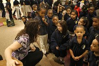 Nadine Grall asks social worker Tara Miller a question after the morning assembly at Xavier School of Excellence on Friday morning. From an enrollment standpoint, Xavier is the largest charter school in South Bend. Staff photo by Santiago Kilbride