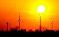 The sun sets over the Wildcat wind farm north of Elwood. E.ON Climate and Renewables has invested $400 million in building phase one of Wildcat 1 Wind Farm.