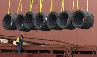 A worker looks on as a load of steel wire coils is pulled from the Malta-flagged Federal Mattawa at the Port of Indiana in Burns Harbor Tuesday April 9, 2013. | Andy Lavalley~Sun-Times Media