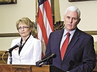 Indiana Gov. Mike Pence, flanked by Lt. Gov. Sue Ellspermann at a press conference, continued his call for 10 percent income tax cut after a Senate Republican budget plan included a much lower rate. Photo by Maureenn Hayden