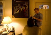 6:13 a.m. Raegan Ball packs up his book bag with the previous night&rsquo;s homework before driving to North High School. Staff photo by Denny Simmons