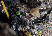 12-26-13 Kokomo Recycling Center Aaron Santiago operates the baler at the Kokomo Recycling Center. KT photo | Kelly Lafferty