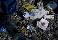 Staff file photo by Denny Simmons. A tote bag full of methamphetamine-making materials is scattered for inspection by the EPD's Meth Suppression Unit recently. The duffel-type bag was found along with 18 other discarded meth labs along a stretch of railroad tracks just south of Oak Hill Cemetery in July 2011.