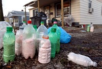 One pot cooks sit in front of the house at 120 S. Purdum after Terry Jarrett, 54, was arrested on a C misdemeanor warrant at which time police found a meth lab in his house. Those charges will be upgraded to a B felony. KPD and the Howard County Drug Task Force were serving warrants for those purchasing too much Sudefed. KT photo | Tim Bath