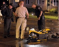 Evansville Police work the scene of an accident involving a motor scooter and a car on Wednesday evening, April 4, 2012. File photo by DENNY SIMMONS / Courier &amp; Press Archives