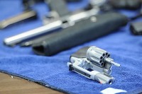 A .22 caliber revolver, one of the guns owned by Donald Koressel, firearms safety instructor, lays on a table and is one of the many types of handguns he teaches his students how to use. Koressel teaches his students how to safely and properly handle and fire a handgun. Staff photo by Erin McCracken