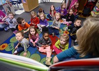 Tribune-Star/Joseph C. Garza More than just a daycare: A prekindergarten student in teacher Loretta Lee's classroom at Union Hospital Child Development Center raises her hand to answer a question on Thursday. The center offers one of the top-rated preschool programs in the state, focusing on the academic and social skills of its students. 