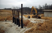 Workers build an overpass for I-69 along South Burch Road in Monroe County near Bloomington, Indiana on March 19, 2014. Herald-Times photo by Jeremy Hogan