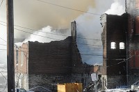 The shell of two buildings are all that was remained on Friday morning after a fire started in downtown North Vernon. Fire crews from more than five departments battled the blaze Friday. Staff photo by Aaron Piper
