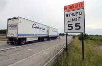 Fall, winter, spring, construction: A semi-truck passes a 55 mph worksite sign on I-70 on July 25, 2014. Staff file photo by Joseph C. Garza