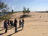Researchers lead media on a tour of Mount Baldy in August 2014. The Indiana Dunes National Lakeshore park remains closed, but the National Park Service will offer ranger-led tours of selected areas of the park this summer. Staff file photo by John Luke