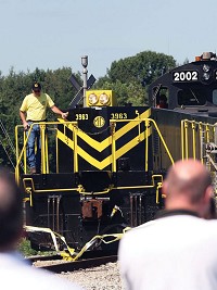 A MG Rail slug and locomotive break through a ribbon entering the Port of Indiana-Jeffersonville in this file photo. Federal funding will help the port build a transportation project.