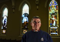 Rev. Don Summerfield of First Presbyterian Church of Jeffersonville began holding murder-site vigils to remember victims of violence more than 10 years ago. Summerfield said the vigils have made him aware of the nature of the violence in the community and feels that there is no harm in expanding gun control measures. Staff photo by Tyler Stewart