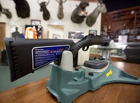 This fall, Indiana deer hunters for the first time will be allowed to use high-powered rifles like the ones displayed at Midwest Gun Exchange in Mishawaka. Tribune Photo/BECKY MALEWITZ