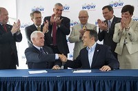Indiana Gov. Mike Pence, (left) and Kentucky Gov. Matt Bevin shake hands after signing a Memorandum of Agreement to begin the I-69 Ohio River Crossing Project at Ellis Park in Henderson, Thursday, June 30, 2016. Staff photo by Alex Slitz
