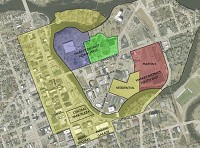 Elkhart leaders envision a flurry of new development in the area dubbed the Market District, the peninsula east of the downtown area. The purple aea, site of the ex-Elkhart YMCA, would house a new aquatics center and gym. The red area, site of Easy Shopping Cener,would be redesigned and reconfigured with a new Martin's Super Market aand new housing abutting the Elkhart River. The yellow area west of that is the site of a proposed 200-unit luxury apartment complex. Photo provided by Jones Petrie Rafinski
