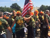 Retired mine workers and their families pray at the conclusion of the Keep The Promise rally in Washington D.C. on Thursday.&nbsp; Staff photo by Jon Webb 