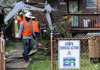 EPA contractors excavate contaminated soil Wednesday at a home in East Calumet,which is part of the USS Lead Superfund site in East Chicago. Staff photo by Jonathan Miano