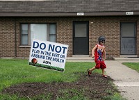 Joshua Foreman, 3, plays at his home in the West Calumet Housing Complex earlier this year in East Chicago. Staff photo by Jonathan Miano