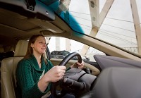 Amy Williams drives across the Kennedy Bridge into Louisville. Staff photo by Josh Hicks