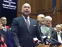 House Speaker Brian Bosma, R-Indianapolis, announces Wednesday a Republican road funding plan that relies on higher vehicles taxes and fees and possible tolling of Interstate highways. To Bosma's right are Rep. Tim Brown, R-Crawfordsville, and Rep. Ed Soliday, R-Valporaiso. Staff photo by Dan Caden