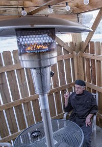 Blue Lantern Restaurant and Lounge chef Joel Galbreath smokes on the smoking patio attached to the restaurant on Friday, Jan. 6, 2017, in Mishawaka. Staff photo by Becky Malewitz
